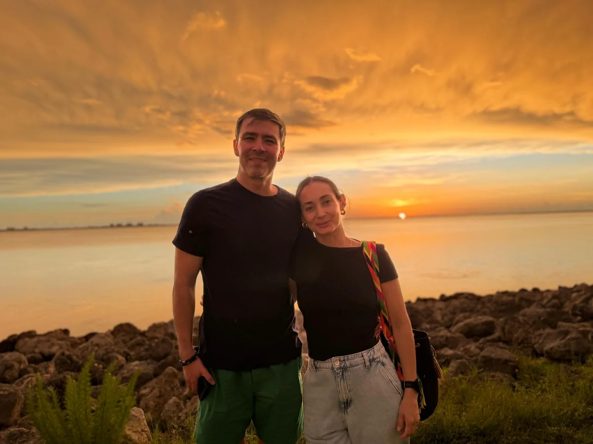 Natalia and Yuri together by the Gulf at sunset